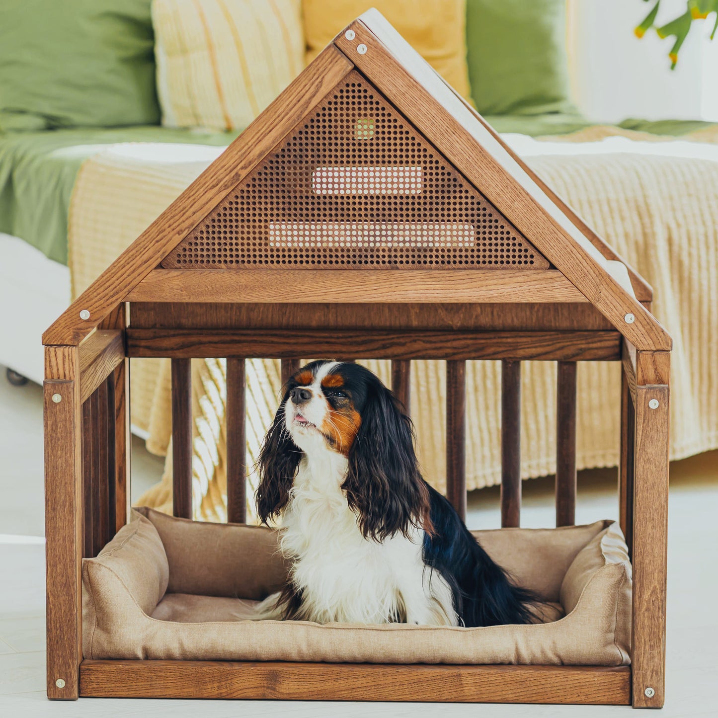 A wooden dog cage house with a built-in cozy design, featuring a natural wood finish and slatted sides for ventilation. Inside, a soft, plush pillow provides comfort, creating a snug and stylish retreat for the dog.