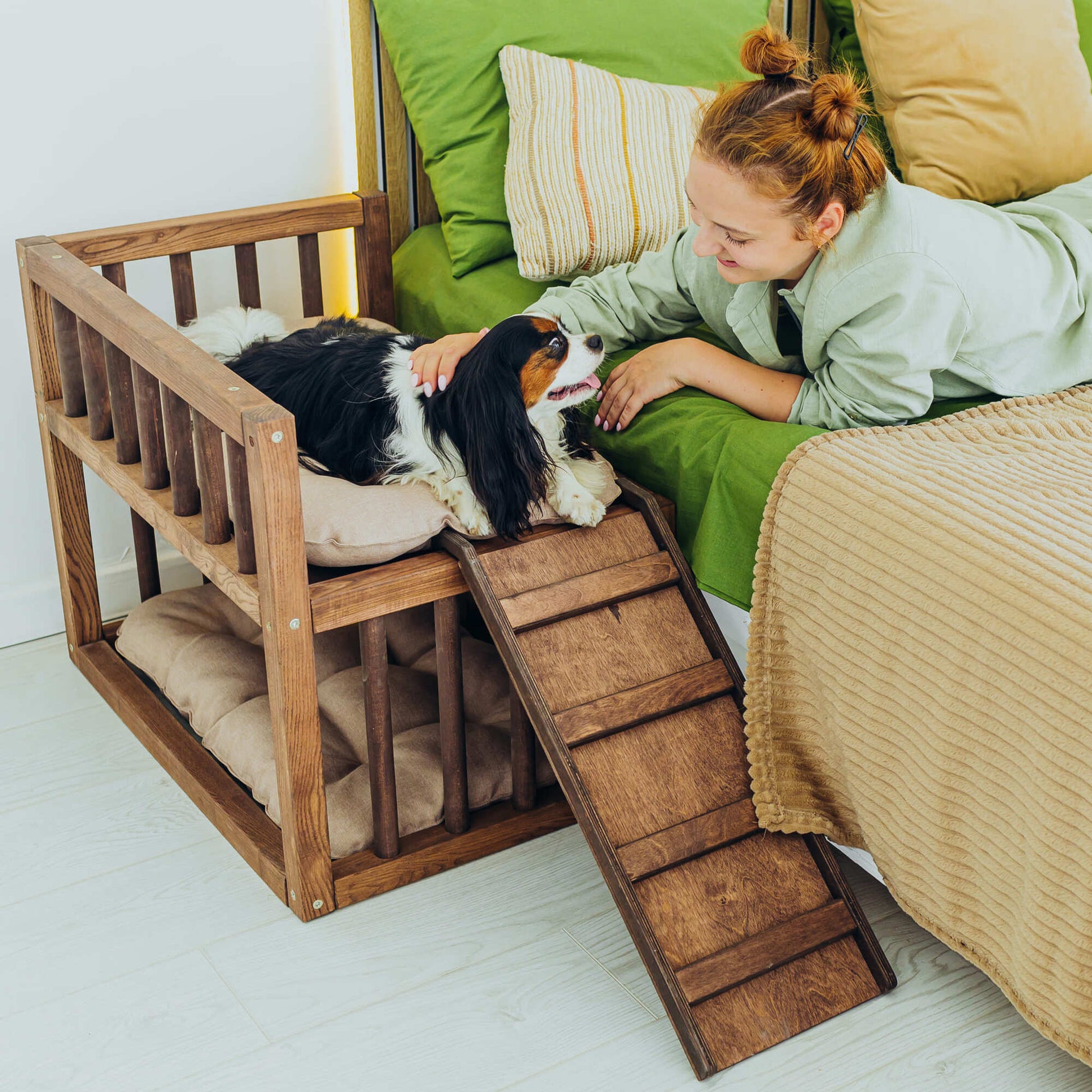 A cozy elevated dog bed with built-in stairs, perfect for providing comfort and easy access for dogs